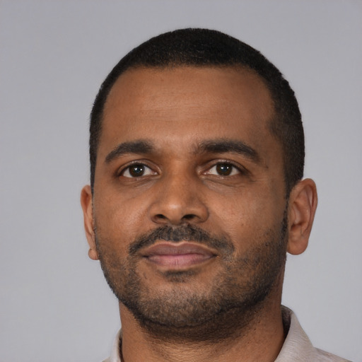 Neutral black young-adult male with short  black hair and brown eyes