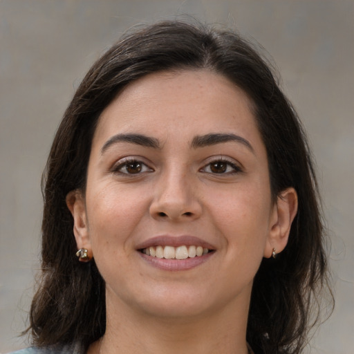 Joyful white young-adult female with medium  brown hair and brown eyes