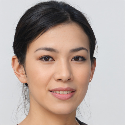Joyful asian young-adult female with medium  brown hair and brown eyes