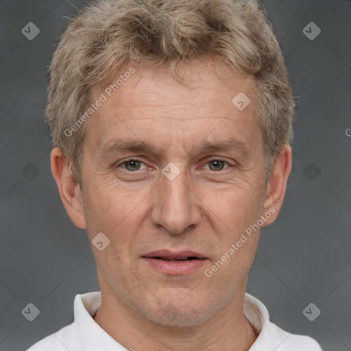 Joyful white middle-aged male with short  brown hair and brown eyes