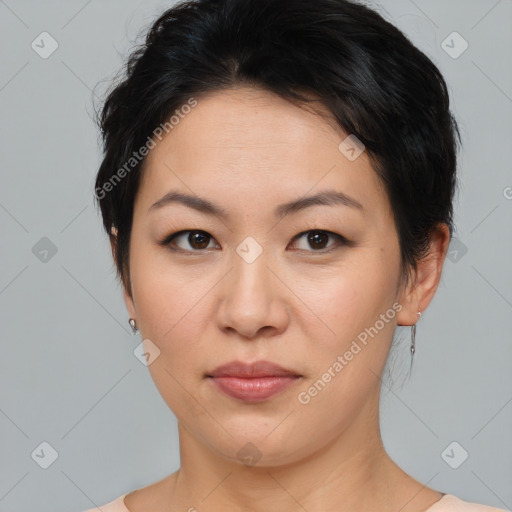 Joyful asian young-adult female with medium  brown hair and brown eyes