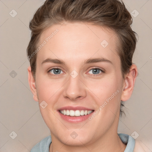 Joyful white young-adult female with short  brown hair and grey eyes