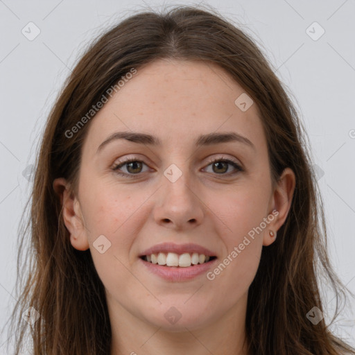 Joyful white young-adult female with long  brown hair and grey eyes