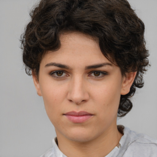 Neutral white young-adult female with short  brown hair and brown eyes