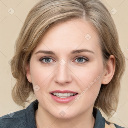 Joyful white young-adult female with medium  brown hair and blue eyes