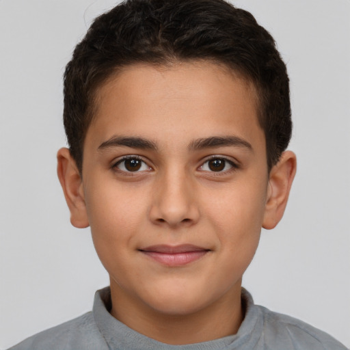 Joyful white child male with short  brown hair and brown eyes