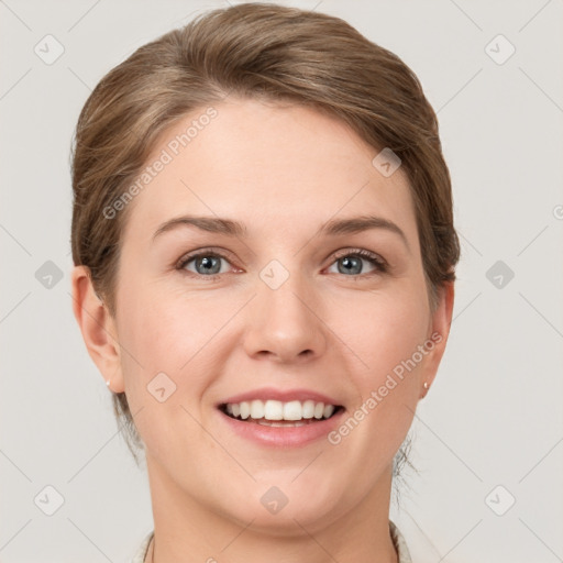 Joyful white young-adult female with short  brown hair and grey eyes