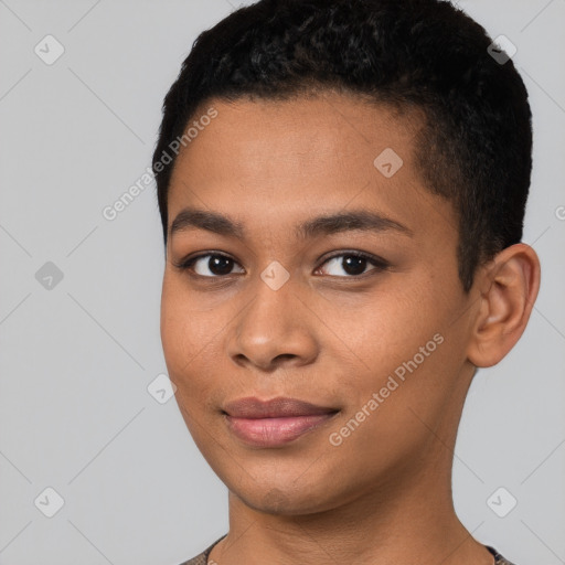 Joyful black young-adult female with short  black hair and brown eyes