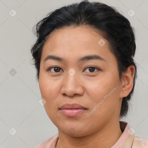 Joyful asian young-adult female with short  brown hair and brown eyes