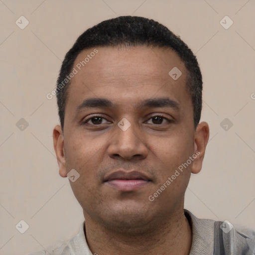 Neutral latino young-adult male with short  black hair and brown eyes