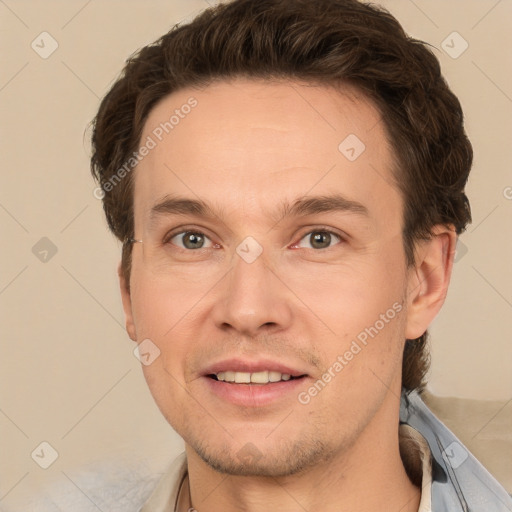 Joyful white adult male with short  brown hair and grey eyes