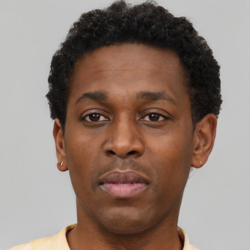 Neutral black young-adult male with short  brown hair and brown eyes