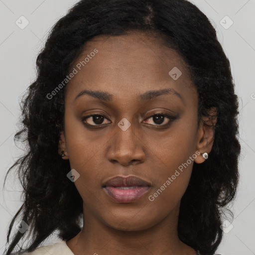 Neutral black young-adult female with long  brown hair and brown eyes