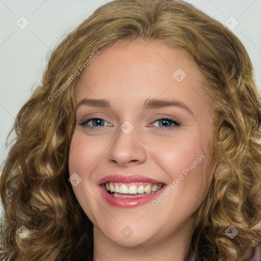 Joyful white young-adult female with long  brown hair and green eyes