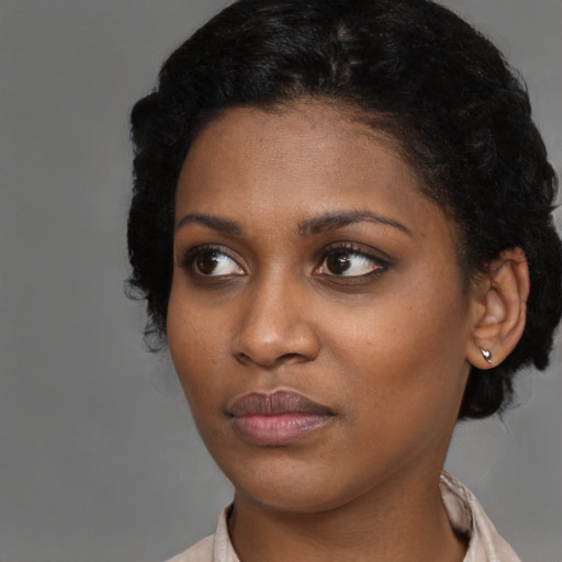 Neutral black young-adult female with short  black hair and brown eyes