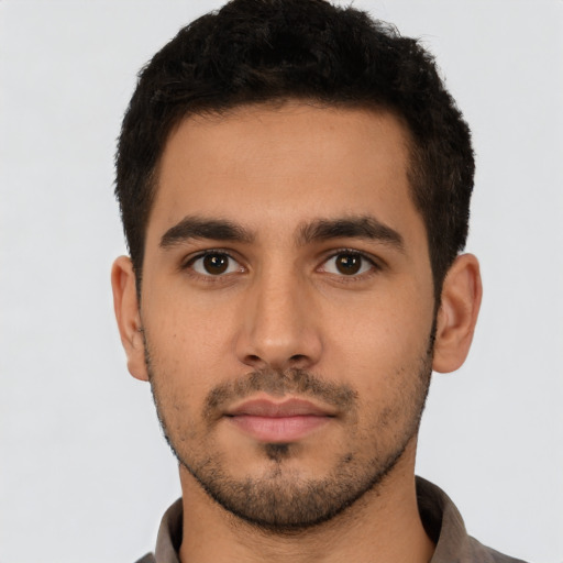 Neutral latino young-adult male with short  black hair and brown eyes
