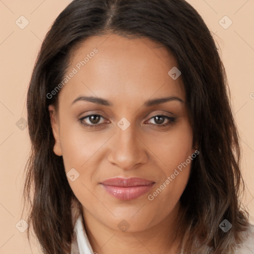 Joyful latino young-adult female with long  brown hair and brown eyes