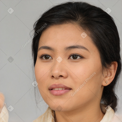 Joyful asian young-adult female with medium  brown hair and brown eyes