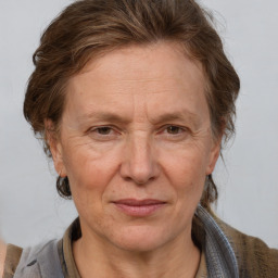 Joyful white middle-aged female with medium  brown hair and brown eyes