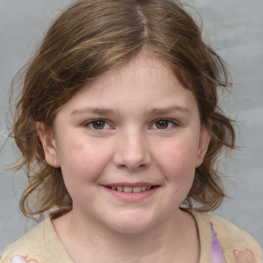 Joyful white child female with medium  brown hair and grey eyes