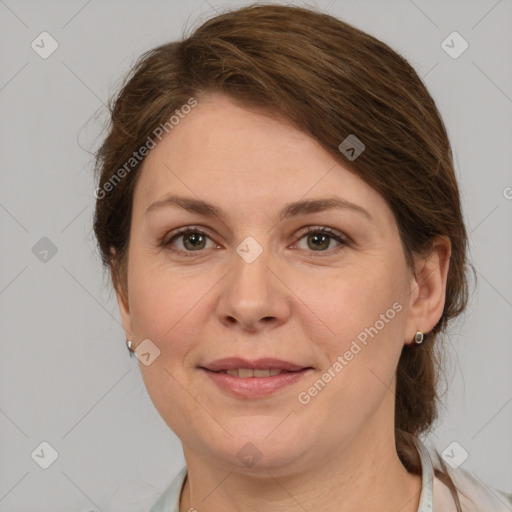 Joyful white adult female with medium  brown hair and grey eyes