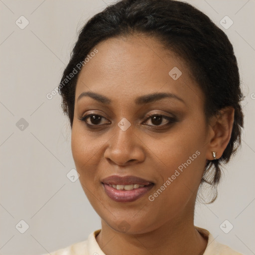 Joyful black young-adult female with medium  brown hair and brown eyes