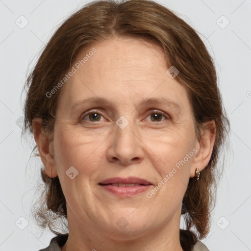 Joyful white adult female with medium  brown hair and grey eyes