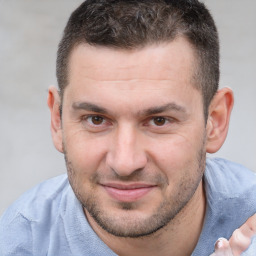 Joyful white adult male with short  brown hair and brown eyes
