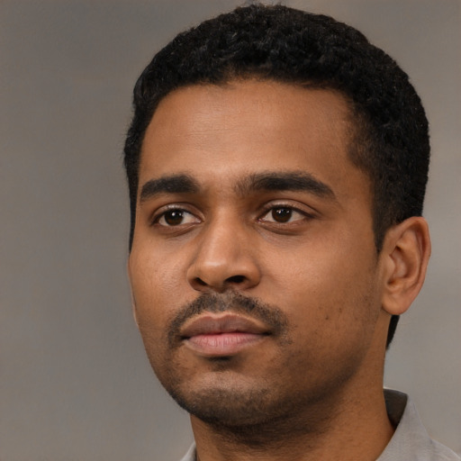 Neutral black young-adult male with short  black hair and brown eyes