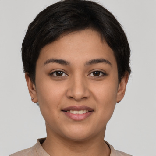 Joyful white young-adult female with short  brown hair and brown eyes
