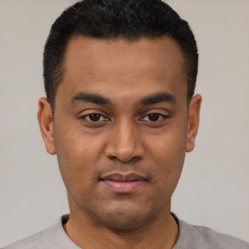 Neutral latino young-adult male with short  black hair and brown eyes