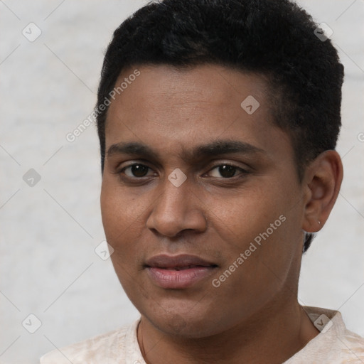 Joyful latino young-adult male with short  black hair and brown eyes