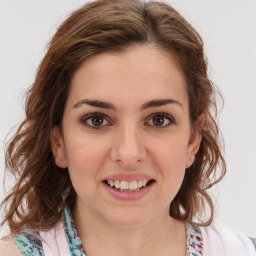 Joyful white young-adult female with medium  brown hair and green eyes