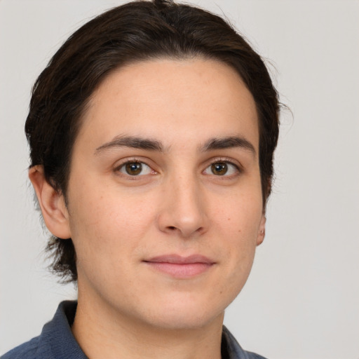 Joyful white young-adult male with medium  brown hair and brown eyes