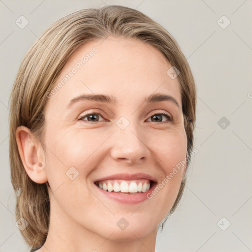 Joyful white young-adult female with medium  brown hair and green eyes