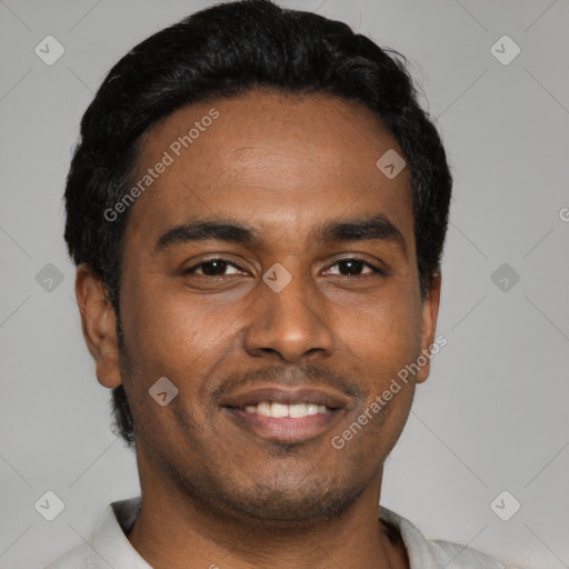 Joyful latino young-adult male with short  black hair and brown eyes