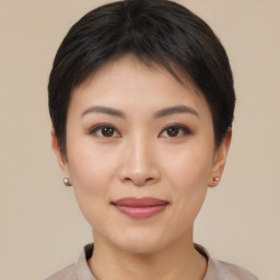 Joyful asian young-adult female with short  brown hair and brown eyes