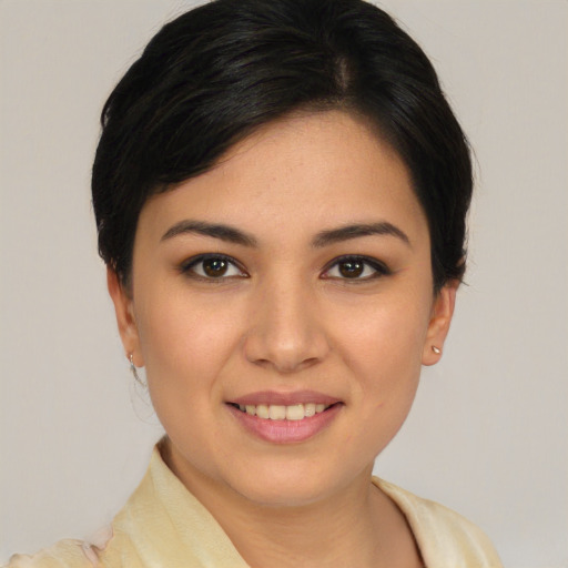 Joyful white young-adult female with short  black hair and brown eyes