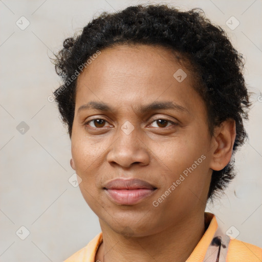 Joyful black young-adult male with short  brown hair and brown eyes