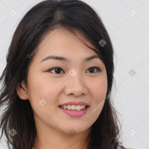 Joyful asian young-adult female with long  brown hair and brown eyes