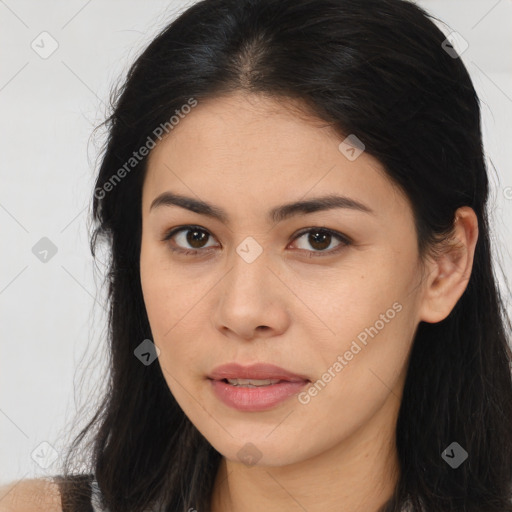 Joyful asian young-adult female with long  brown hair and brown eyes