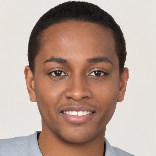 Joyful black young-adult male with short  brown hair and brown eyes