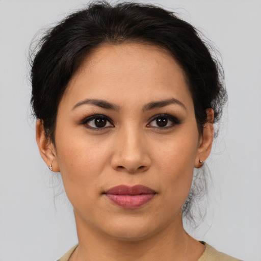 Joyful asian young-adult female with short  brown hair and brown eyes