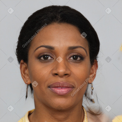 Joyful black adult female with medium  brown hair and brown eyes