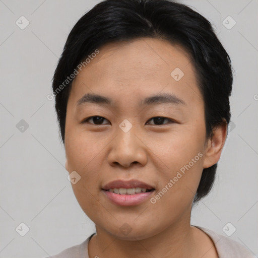 Joyful asian young-adult female with short  brown hair and brown eyes