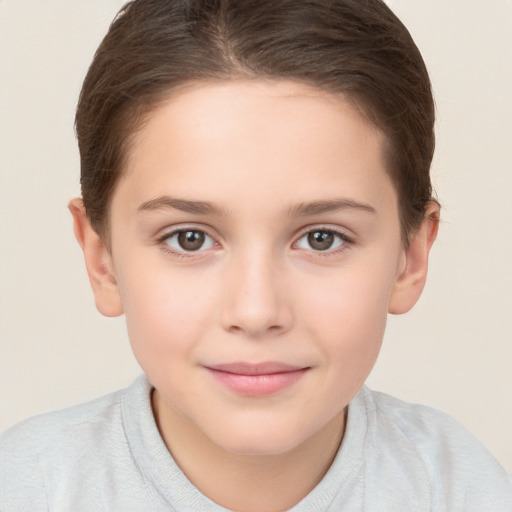 Joyful white child female with short  brown hair and brown eyes