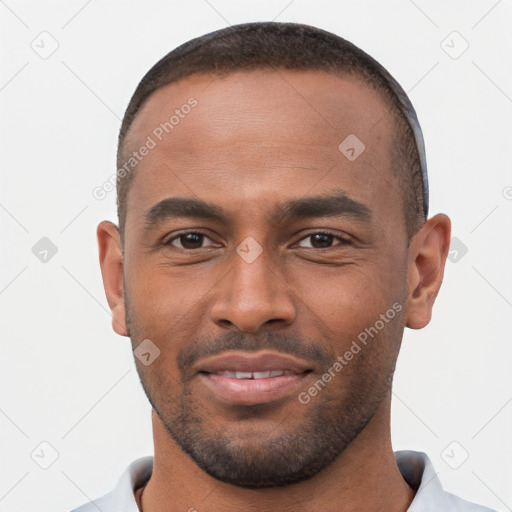 Joyful black young-adult male with short  brown hair and brown eyes