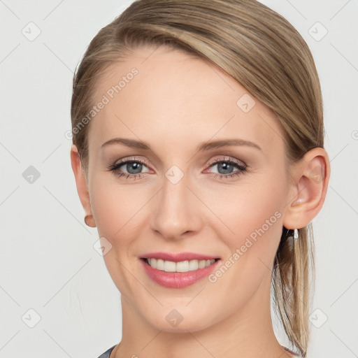 Joyful white young-adult female with medium  brown hair and blue eyes