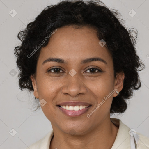 Joyful latino adult female with short  brown hair and brown eyes