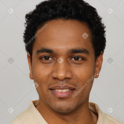 Joyful black young-adult male with short  black hair and brown eyes